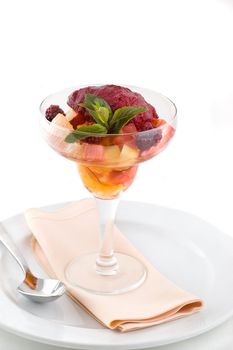 Sweet dessert with ice cream and fruits.
