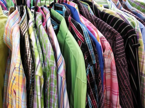 A rack full of colorful shirts.