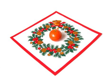 one mandarin on the napkin with christmas pattern isolated