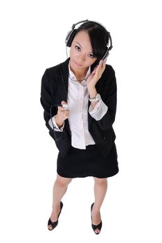 Business woman listen music by headphone and Mp3 player in office, full length portrait isolated on white background.