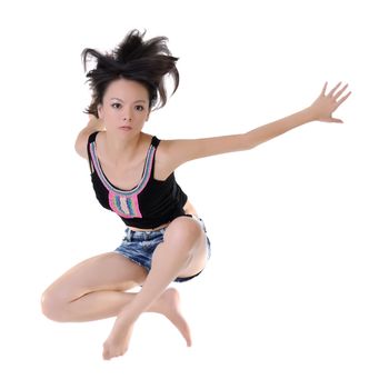Modern style dancer jumping on white studio background.