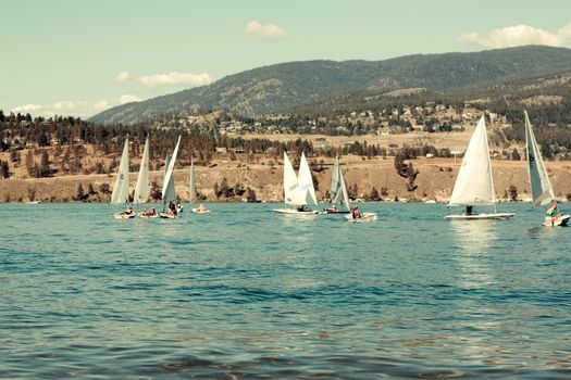 yacht sails on the blue water in a sunny day