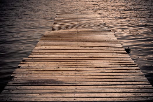 footbridge on the blue water in a sunny day