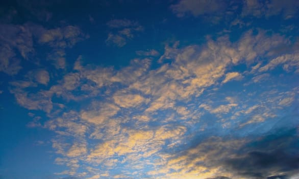 Yellow clouds under blue sky