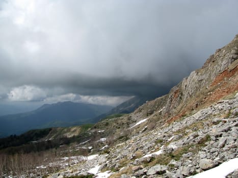 Stones, rocks; a relief; a landscape; a hill; a panorama; mountains