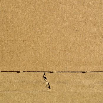 Brown corrugated cardboard sheet background material texture