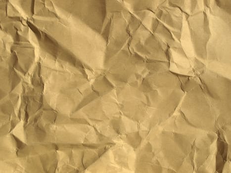 Sheet of brown and rippled paper background