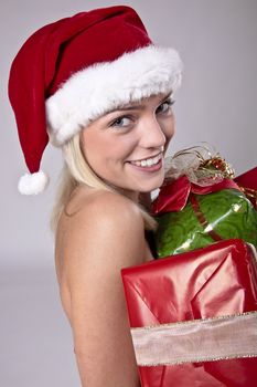 Beautiful Blond Girl Holding A Lot Of Christmas Presents