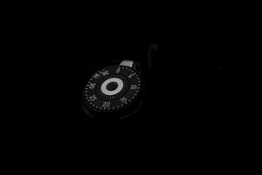 Old analog photo camera in black background