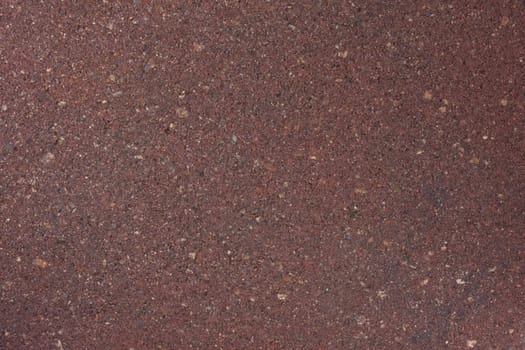 red background of a wet clay stepping stone or paver 