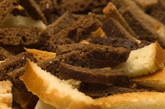 Background of rye and wheat crackers salty closeup.