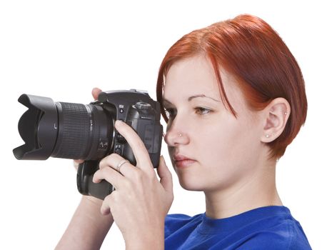 Portrait of a redheaded girl photographer isolated against a white background.