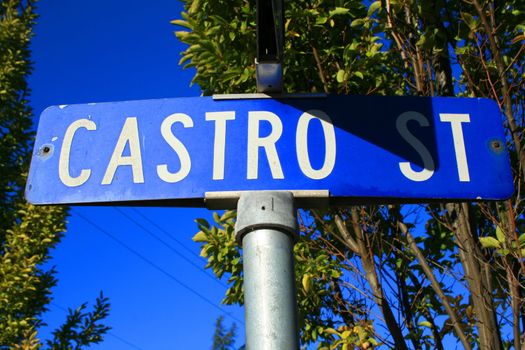 Street sign close up over blue sky.
