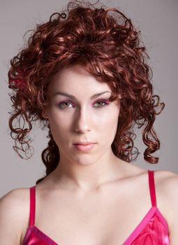 Beautiful redhaired girl with long red curls
