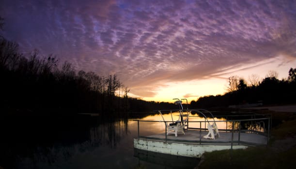 A dramatic sunset over the Jackson Blue Springs Millpond in Marianna Florida