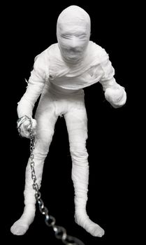 Man in costume mummy with chain to hold on a lead