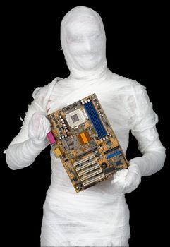 Man of bandaged with motherboard on the black background