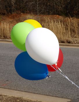 Balloons up close in the road to show where to turn