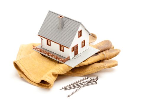House, Gloves and Nails Isolated on a White Background.