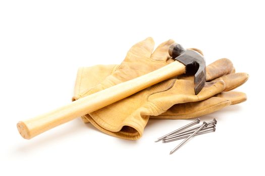 Hammer, Gloves and Nails Isolated on a White Background.