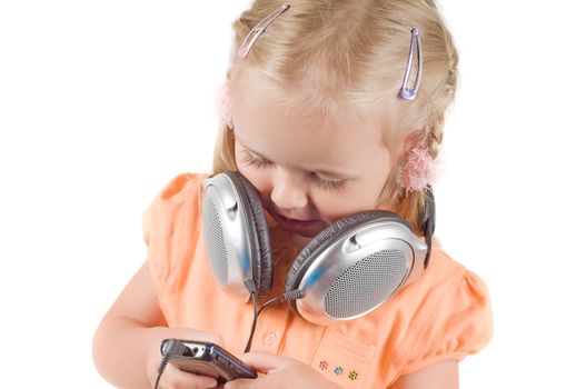 Shot of little girl with headphones in studio