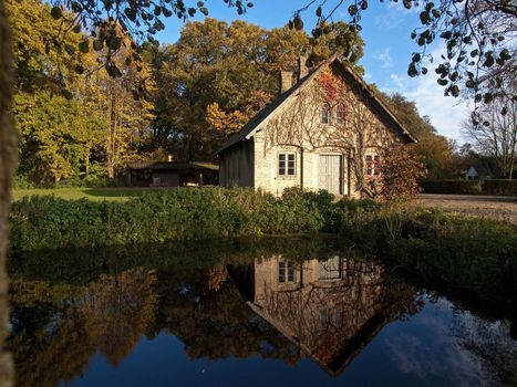 Beautiful countryside house reflected in a lake Denmark