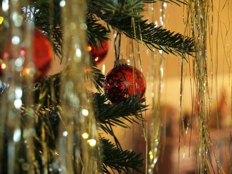 Beautiful hanging Christmas decorations ornaments on a tree    