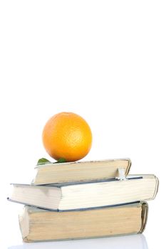 orange on books isolated on white