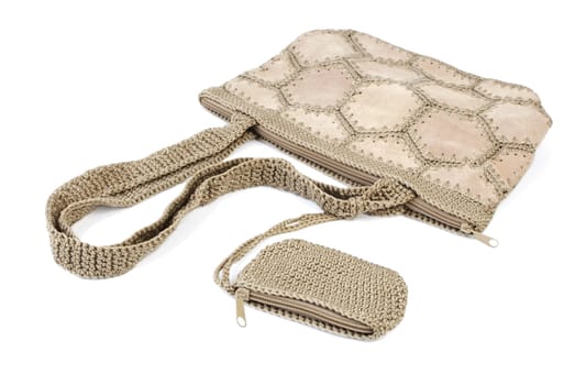 Beige leather bag with knitted elements and wallet. Isolated on white background