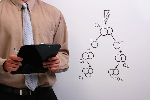 Man in a shirt and a tie holding a clipboard explaining the formation of ozone.