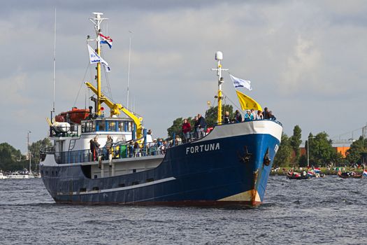 SAIL AMSTERDAM 2010 -IJMUIDEN, THE NETHERLANDS - AUGUST 2010: Sail 2010 starts with the spectaculair Sail-in Parade.  50 Tall ships and more than 500 of  naval ships, replicas and yachts sail in convoy through the North Sea Canal from IJmuiden to Amsterdam. Thousands of private boats accompany the fleet and more than 300.000 visitors watch the parade from the banks. August 19, 2010, IJmuiden, the Netherlands