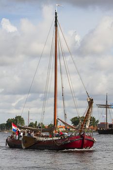 SAIL AMSTERDAM 2010 -IJMUIDEN, THE NETHERLANDS - AUGUST 2010: Sail 2010 starts with the spectaculair Sail-in Parade.  50 Tall ships and more than 500 of  naval ships, replicas and yachts sail in convoy through the North Sea Canal from IJmuiden to Amsterdam. Thousands of private boats accompany the fleet and more than 300.000 visitors watch the parade from the banks. August 19, 2010, IJmuiden, the Netherlands