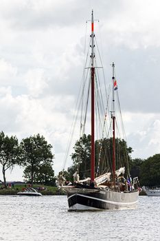 SAIL AMSTERDAM 2010 -IJMUIDEN, THE NETHERLANDS - AUGUST 2010: Sail 2010 starts with the spectaculair Sail-in Parade.  50 Tall ships and more than 500 of  naval ships, replicas and yachts sail in convoy through the North Sea Canal from IJmuiden to Amsterdam. Thousands of private boats accompany the fleet and more than 300.000 visitors watch the parade from the banks. August 19, 2010, IJmuiden, the Netherlands