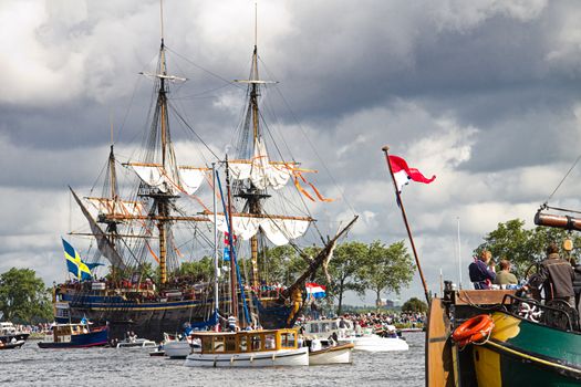 SAIL AMSTERDAM 2010 -IJMUIDEN, THE NETHERLANDS - AUGUST 2010: Sail 2010 starts with the spectaculair Sail-in Parade.  50 Tall ships and more than 500 of  naval ships, replicas and yachts sail in convoy through the North Sea Canal from IJmuiden to Amsterdam. Thousands of private boats accompany the fleet and more than 300.000 visitors watch the parade from the banks. August 19, 2010, IJmuiden, the Netherlands