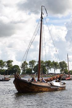 SAIL AMSTERDAM 2010 -IJMUIDEN, THE NETHERLANDS - AUGUST 2010: Sail 2010 starts with the spectaculair Sail-in Parade.  50 Tall ships and more than 500 of  naval ships, replicas and yachts sail in convoy through the North Sea Canal from IJmuiden to Amsterdam. Thousands of private boats accompany the fleet and more than 300.000 visitors watch the parade from the banks. August 19, 2010, IJmuiden, the Netherlands