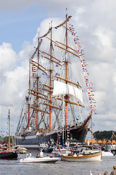 SAIL AMSTERDAM 2010 -IJMUIDEN, THE NETHERLANDS - AUGUST 2010: Sail 2010 starts with the spectaculair Sail-in Parade.  50 Tall ships and more than 500 of  naval ships, replicas and yachts sail in convoy through the North Sea Canal from IJmuiden to Amsterdam. Thousands of private boats accompany the fleet and more than 300.000 visitors watch the parade from the banks. August 19, 2010, IJmuiden, the Netherlands