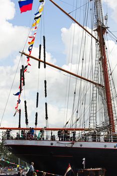 SAIL AMSTERDAM 2010 -IJMUIDEN, THE NETHERLANDS - AUGUST 2010: Sail 2010 starts with the spectaculair Sail-in Parade.  50 Tall ships and more than 500 of  naval ships, replicas and yachts sail in convoy through the North Sea Canal from IJmuiden to Amsterdam. Thousands of private boats accompany the fleet and more than 300.000 visitors watch the parade from the banks. August 19, 2010, IJmuiden, the Netherlands