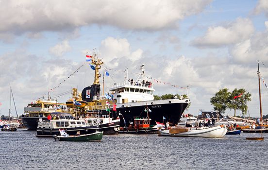 SAIL AMSTERDAM 2010 -IJMUIDEN, THE NETHERLANDS - AUGUST 2010: Sail 2010 starts with the spectaculair Sail-in Parade.  50 Tall ships and more than 500 of  naval ships, replicas and yachts sail in convoy through the North Sea Canal from IJmuiden to Amsterdam. Thousands of private boats accompany the fleet and more than 300.000 visitors watch the parade from the banks. August 19, 2010, IJmuiden, the Netherlands