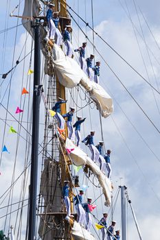 SAIL AMSTERDAM 2010 -IJMUIDEN, THE NETHERLANDS - AUGUST 2010: Sail 2010 starts with the spectaculair Sail-in Parade.  50 Tall ships and more than 500 of  naval ships, replicas and yachts sail in convoy through the North Sea Canal from IJmuiden to Amsterdam. Thousands of private boats accompany the fleet and more than 300.000 visitors watch the parade from the banks. August 19, 2010, IJmuiden, the Netherlands