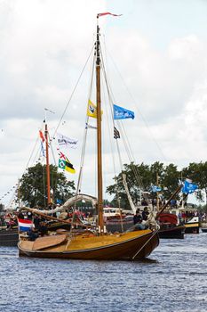 SAIL AMSTERDAM 2010 -IJMUIDEN, THE NETHERLANDS - AUGUST 2010: Sail 2010 starts with the spectaculair Sail-in Parade.  50 Tall ships and more than 500 of  naval ships, replicas and yachts sail in convoy through the North Sea Canal from IJmuiden to Amsterdam. Thousands of private boats accompany the fleet and more than 300.000 visitors watch the parade from the banks. August 19, 2010, IJmuiden, the Netherlands