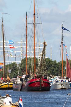 SAIL AMSTERDAM 2010 -IJMUIDEN, THE NETHERLANDS - AUGUST 2010: Sail 2010 starts with the spectaculair Sail-in Parade.  50 Tall ships and more than 500 of  naval ships, replicas and yachts sail in convoy through the North Sea Canal from IJmuiden to Amsterdam. Thousands of private boats accompany the fleet and more than 300.000 visitors watch the parade from the banks. August 19, 2010, IJmuiden, the Netherlands