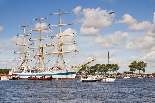 SAIL AMSTERDAM 2010 -IJMUIDEN, THE NETHERLANDS - AUGUST 2010: Sail 2010 starts with the spectaculair Sail-in Parade.  50 Tall ships and more than 500 of  naval ships, replicas and yachts sail in convoy through the North Sea Canal from IJmuiden to Amsterdam. Thousands of private boats accompany the fleet and more than 300.000 visitors watch the parade from the banks. August 19, 2010, IJmuiden, the Netherlands