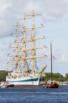 SAIL AMSTERDAM 2010 -IJMUIDEN, THE NETHERLANDS - AUGUST 2010: Sail 2010 starts with the spectaculair Sail-in Parade.  50 Tall ships and more than 500 of  naval ships, replicas and yachts sail in convoy through the North Sea Canal from IJmuiden to Amsterdam. Thousands of private boats accompany the fleet and more than 300.000 visitors watch the parade from the banks. August 19, 2010, IJmuiden, the Netherlands