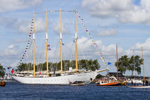 SAIL AMSTERDAM 2010 -IJMUIDEN, THE NETHERLANDS - AUGUST 2010: Sail 2010 starts with the spectaculair Sail-in Parade.  50 Tall ships and more than 500 of  naval ships, replicas and yachts sail in convoy through the North Sea Canal from IJmuiden to Amsterdam. Thousands of private boats accompany the fleet and more than 300.000 visitors watch the parade from the banks. August 19, 2010, IJmuiden, the Netherlands