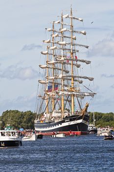 SAIL AMSTERDAM 2010 -IJMUIDEN, THE NETHERLANDS - AUGUST 2010: Sail 2010 starts with the spectaculair Sail-in Parade.  50 Tall ships and more than 500 of  naval ships, replicas and yachts sail in convoy through the North Sea Canal from IJmuiden to Amsterdam. Thousands of private boats accompany the fleet and more than 300.000 visitors watch the parade from the banks. August 19, 2010, IJmuiden, the Netherlands