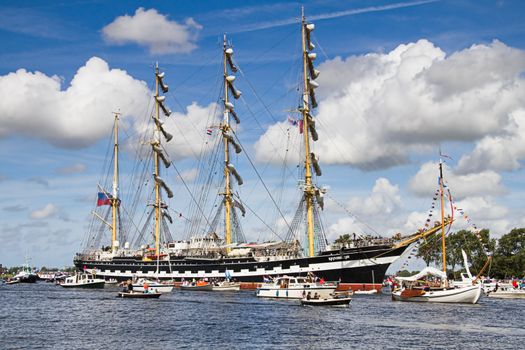 SAIL AMSTERDAM 2010 -IJMUIDEN, THE NETHERLANDS - AUGUST 2010: Sail 2010 starts with the spectaculair Sail-in Parade.  50 Tall ships and more than 500 of  naval ships, replicas and yachts sail in convoy through the North Sea Canal from IJmuiden to Amsterdam. Thousands of private boats accompany the fleet and more than 300.000 visitors watch the parade from the banks. August 19, 2010, IJmuiden, the Netherlands