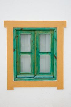 Traditional green window on white background.