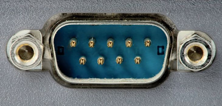 Dark blue computer com-port connector photographing close up