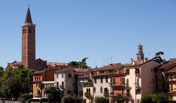 Adige river with St Anastasia church on skyline