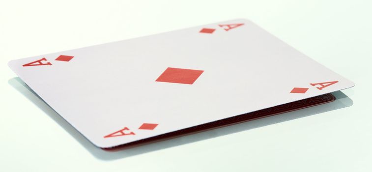 The ace of diamonds on the smooth surface background